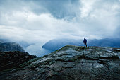 traveler looking on the fjords, hiking in Norway