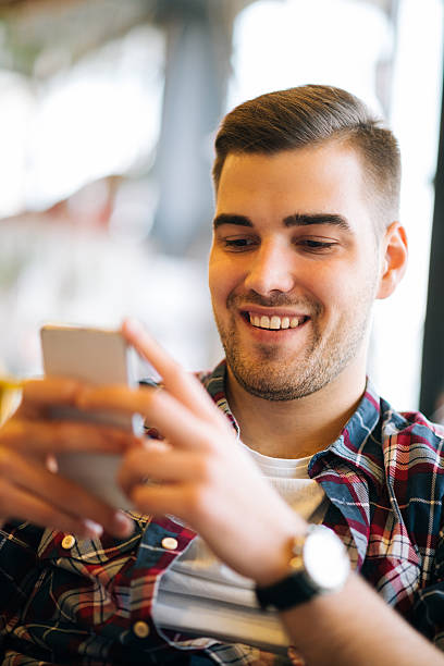 istock Handsome young man using smartphone for business communication and chat 497258876
