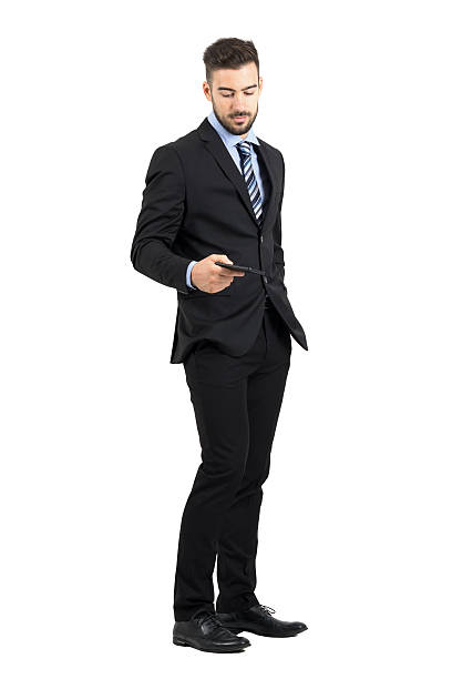istock Handsome businessman taking cellphone from his pocket side view 497259660