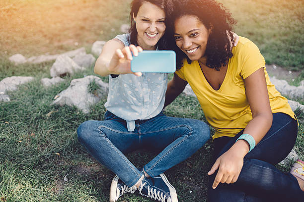 istock Mixed race girls taking a selfie 497260950