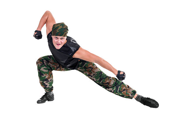 istock Man dressed soldier posing in front fighter isolated on white 497261028
