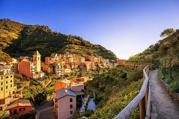 Manarola village, trekking trail, church and vineyard. Cinque Terre National Park, Liguria Italy Europe. Long Exposure