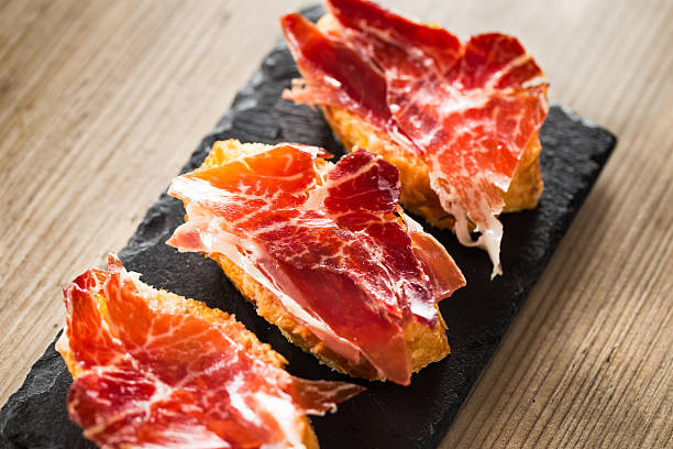 tapas de jamón ibérico de bellota - serrano chilli pepper meat ham spain fotografías e imágenes de stock