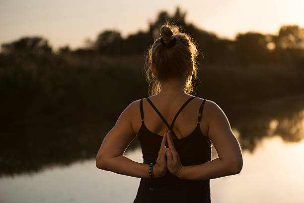 istock woman doing yoga 497263772