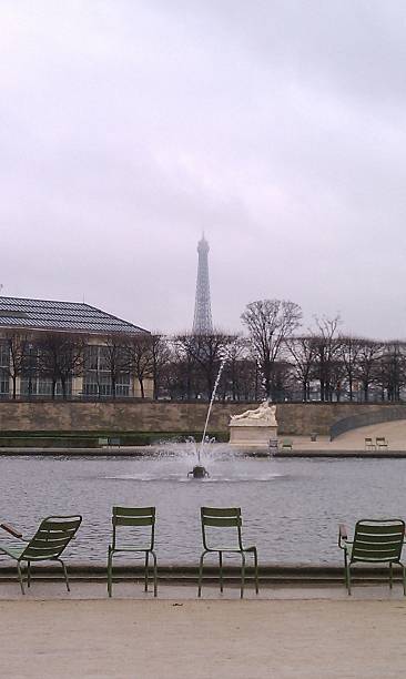 istock Fountain Chairs at the Bassin Octagonal-Eiffel Tower in Distance 497268289