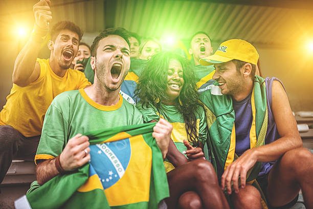 istock Group of brazilian supporters at stadium 497268411