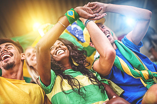 istock Group of brazilian supporters at stadium 497268413