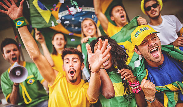 istock Group of brazilian supporters at stadium 497268421