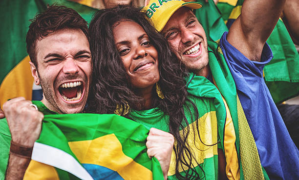 istock Group of brazilian supporters at stadium 497268423