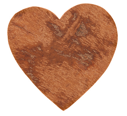 Heart made out of wood on white