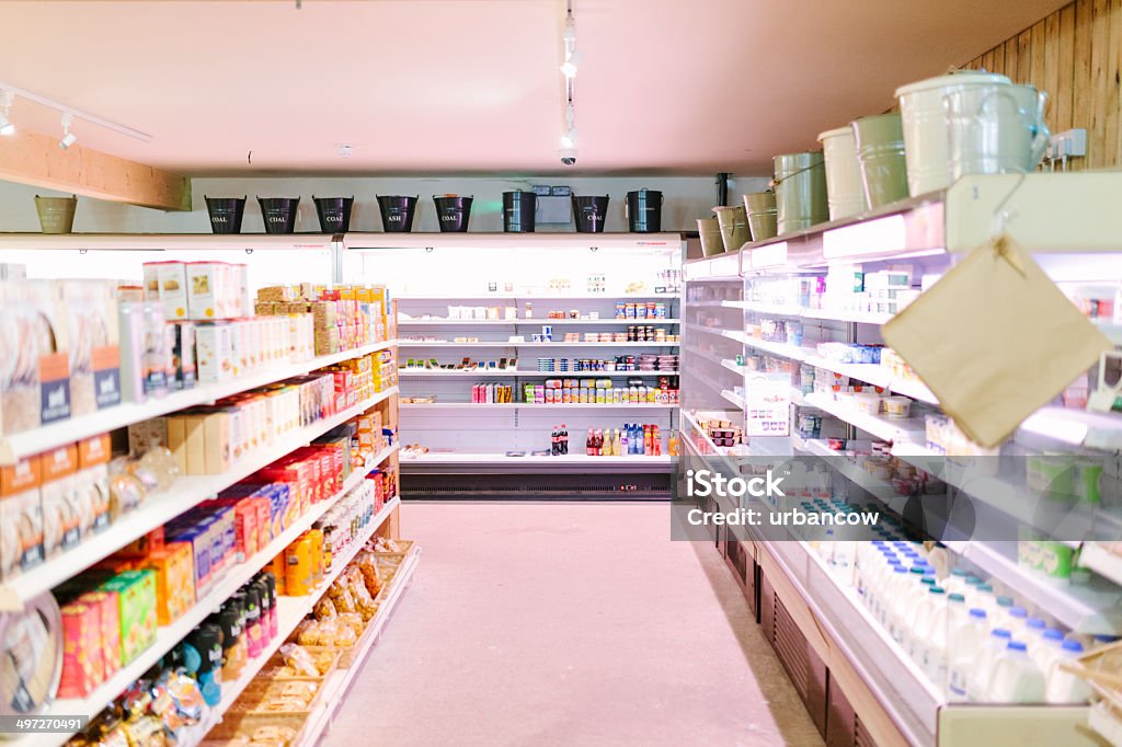 Supermarket, dairy aisle The dairy refrigerator in a small local supermarket, Miller's Farm Shop, Musbury, Devon.  Convenience Store Stock Photo