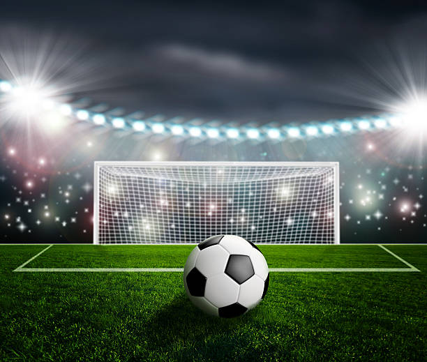istock Soccer ball on green stadium arena 497272905