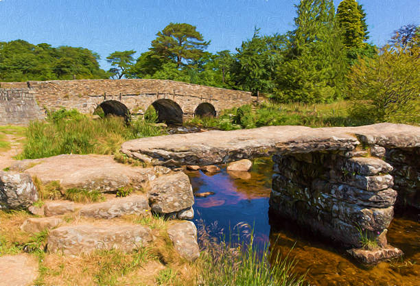 Dartmoor, a nature reserve in the south western part of England  is a unique place with wild, open moorlands and deep river valleys, with a rich history and rare wildlife. One of the most popular destinations in Dartmoor National Park, Postbridge is famous for its old medieval clapper bridge, one of the best preserved clapper bridge on Dartmoor. Immediately beside the clapper bridge is a second bridge, built in the 1780s to replace the medieval bridge an take traffic between Moretonhampstead and Tavistock. Both bridges are now listed structures, preserved for their heritage value.