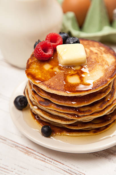 istock High pile of delicious pancakes 497274960