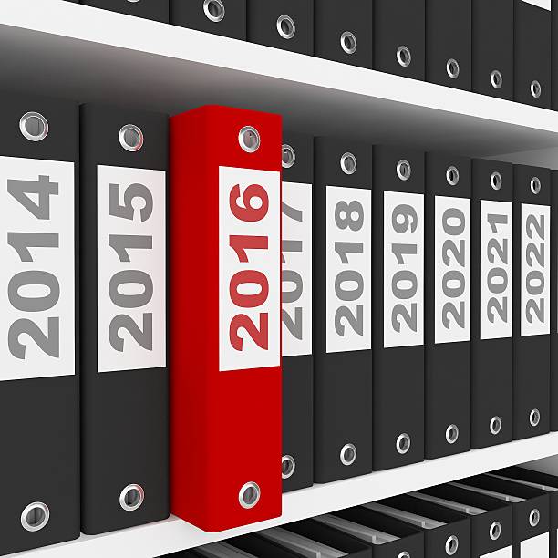 istock Office Folders with New Year 2016 Sign on the shelves 497276860