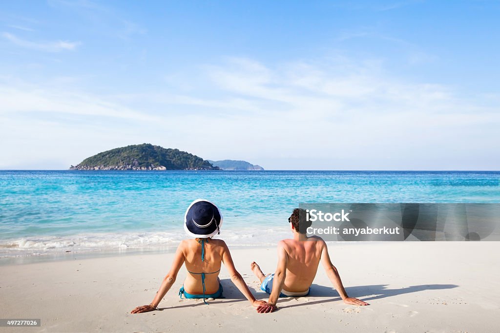 honeymoon honeymoon destination, young happy couple relaxing on paradise beach Beach Stock Photo