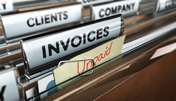 Unpaid invoices, Financial Concept Close up on a file tab with the word invoice and a note where it is handwritten unpaid with blur effect. Concept image for illustration of unpaid invoices recovery. collection stock pictures, royalty-free photos & images