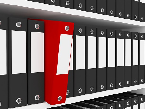 Close-up of file folders on the shelves at office