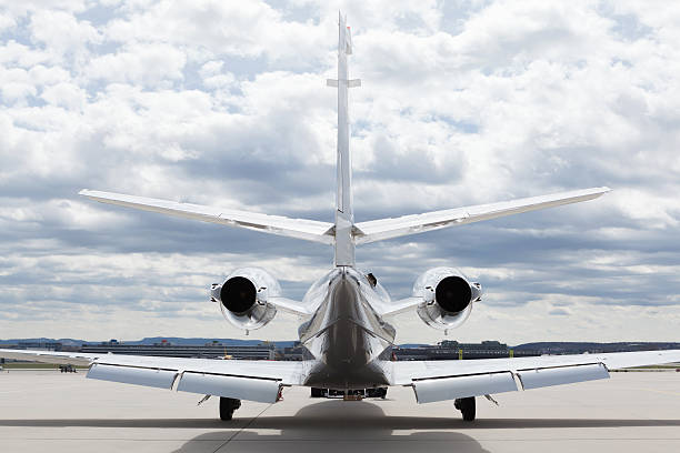 istock Aircraft learjet Plane in front of Airport with cloudy sky 497278022
