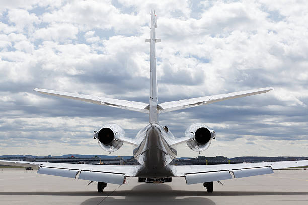 istock Aircraft learjet Plane in front of Airport with cloudy sky 497278058