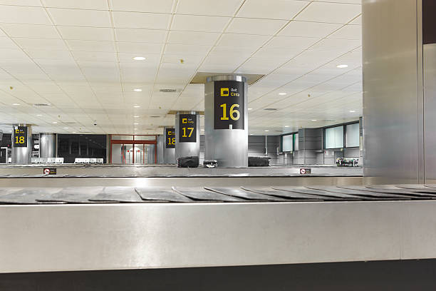 istock Baggage claim belts area in a modern airport. Nobody 497279194