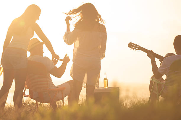 istock Sunset Beach party with a group of friends 497279833