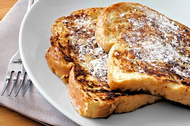 French Toast Plate of French Toast with powdered sugar french toast stock pictures, royalty-free photos & images