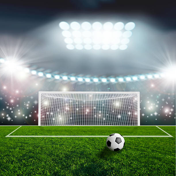 istock Soccer ball on green stadium arena 497280623