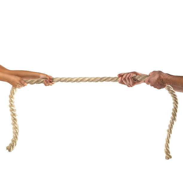 istock Hands of people pulling the rope on white background. 497280816