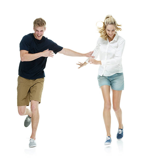istock Cheerful young couple running 497280893