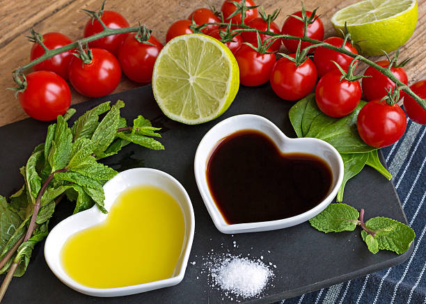 istock Oil and vinegar displayed with fresh produce 497281002
