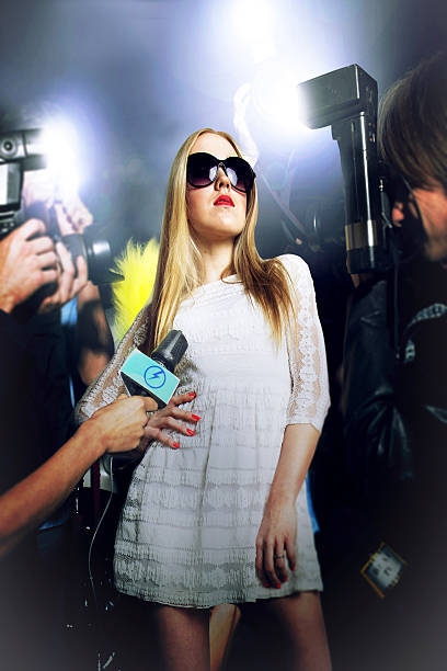istock Young woman being photographed 497281169
