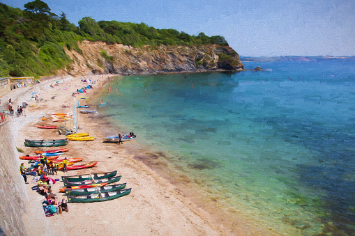 Holidaymakers on Porthpean beach Cornwall England near St Austell with blue sea on a beautiful summer day