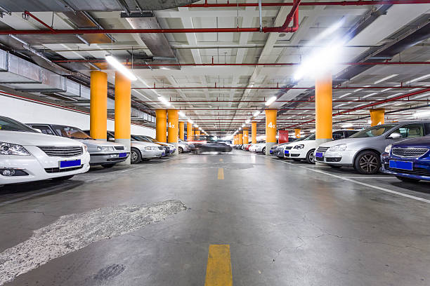istock Parking garage, underground interior with a few parked cars 497282639