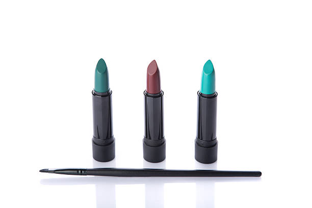 istock Beauty products, makeup brush and three lipsticks 497283176