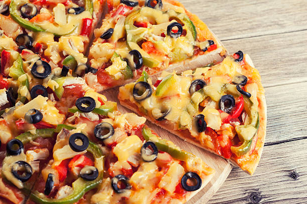 istock Delicious italian pizza served on wooden table 497284187