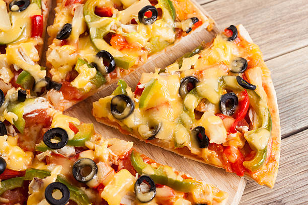 istock Delicious italian pizza served on wooden table 497284189