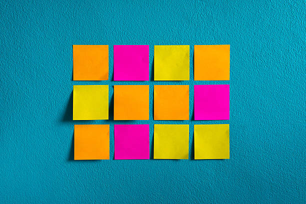 Sticks note paper on wall stock photo