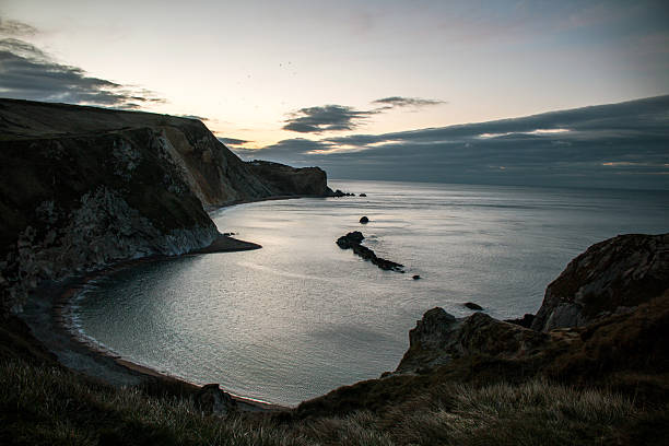 istock Durdle Door sunrise- Dorset beach 497284500