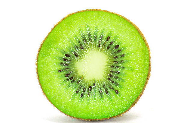 istock Cross section of ripe kiwi on white background 497284968