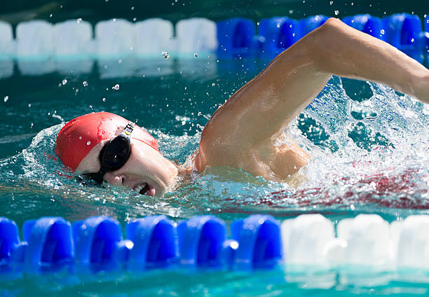 istock Young Woman Swimming 497285443