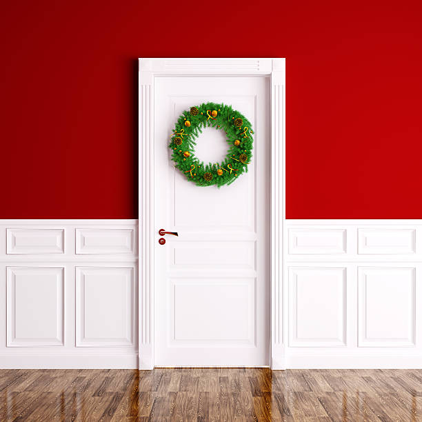 istock Christmas wreath on the white door 3d rendering 497286436