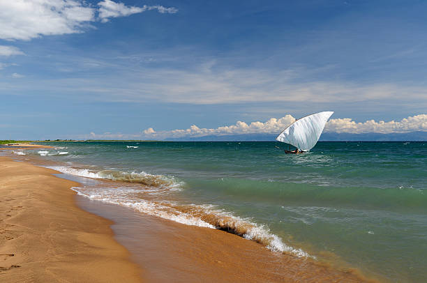 Lake Tanganyika, Tanzania Tanganyika lake is the Worlds longest and second deepest fresh water lake, it is also one of the oldest lakes on the planet. The picture presents beautiful sand beach, Tanzania manda stock pictures, royalty-free photos & images