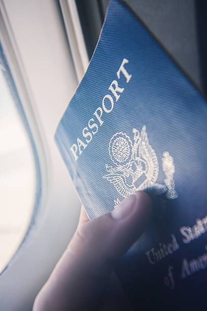 istock Point of View Passport on Airplane 497289696