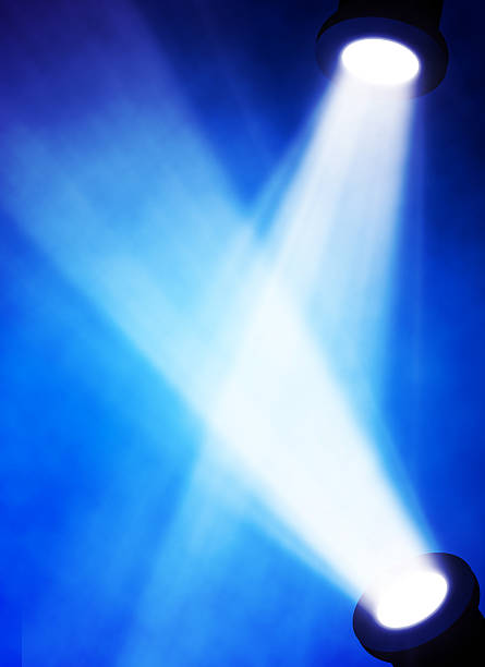 istock illustration of bright stage spotlight 497297477