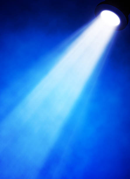 istock illustration of bright stage spotlight 497297493