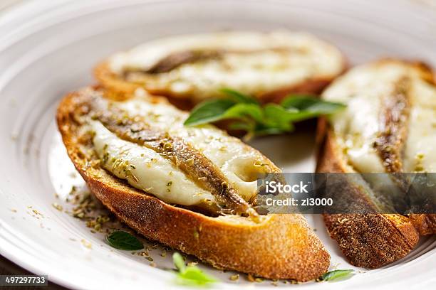 Crostini With Fish Mozzarella And Oregano Stock Photo - Download Image Now - Anchovy, Toasted Bread, Cheese