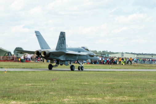 Kallinge, Sweden - June 01, 2014: Swedish Air Force air show 2014 at F 17 Wing. McDonnell Douglas F/A-18 Hornet, crowd in background.