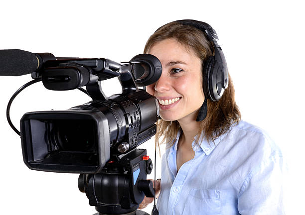 istock young woman with a video camera 497298029
