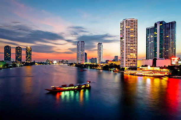 istock Bangkok Transportation at Dusk with Building along the river 497298211